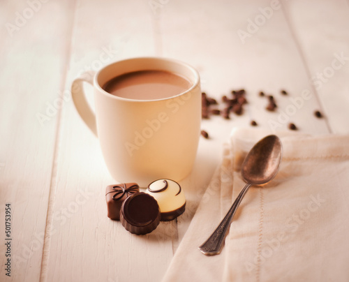 cup of coffee with chocolates