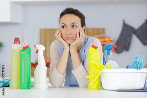 a bored woman is tired of cleaning