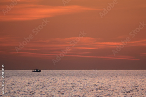 Sailing boat at sea. Sailboat management. Evening sea landscape.