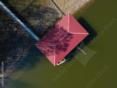 Zenit view of houseboat on the lake. Gualtieri, Italy photo