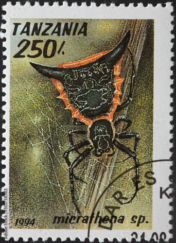 TANZANIA - CIRCA 1994: a postage stamp from TANZANIA, showing an Arachnid the Woodland Orb-Weaver (Micrathena sp.) . Circa 1994 photo