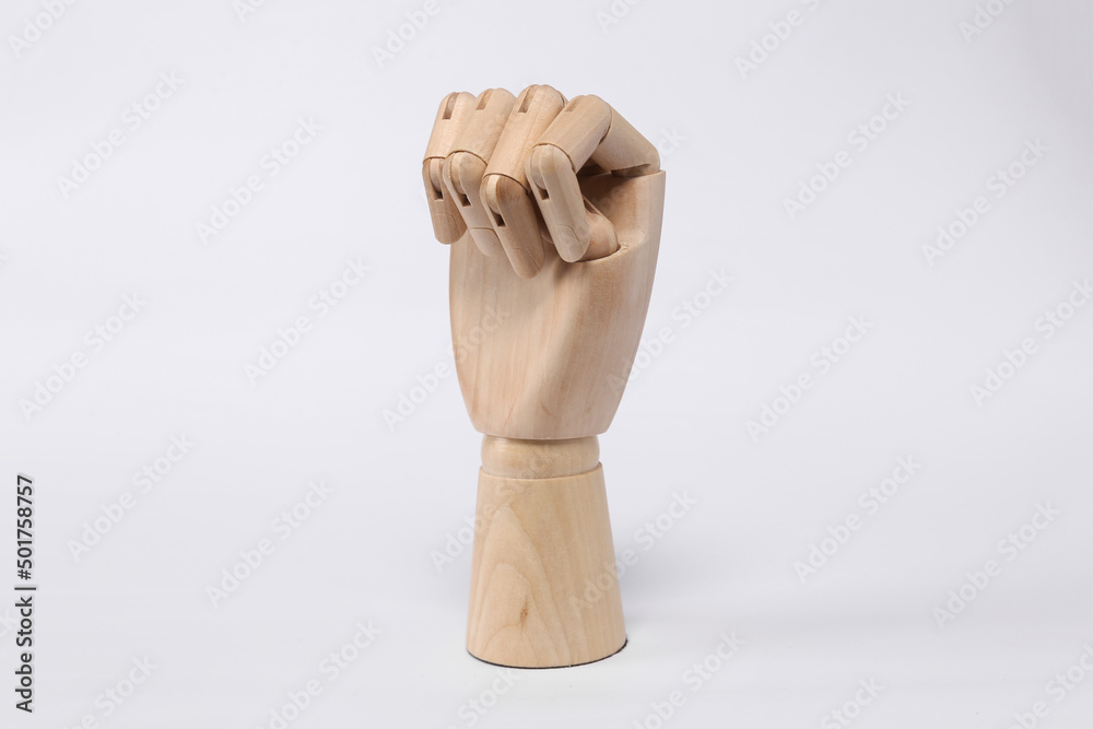 Wooden hand fist on white background Wooden hand fist on white background