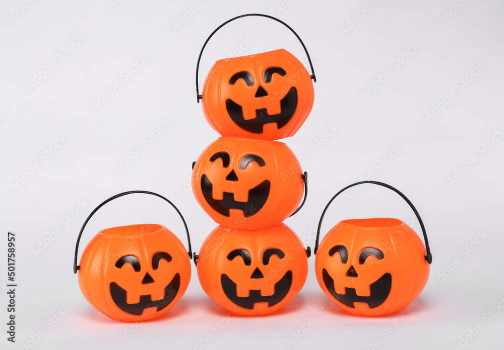 Stack of plastic jack'o lantern candy buckets for halloween. Trick or Treat Stack of plastic jack'o lantern candy buckets for halloween. Trick or Treat