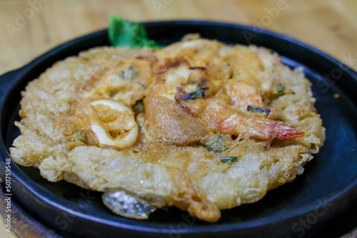 Thai Style Seafood omelette Hot Plate serve in the restaurant