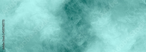 Abstract gray smoke floats up the soft dark blue background, an empty dark scene, the interior texture for display products