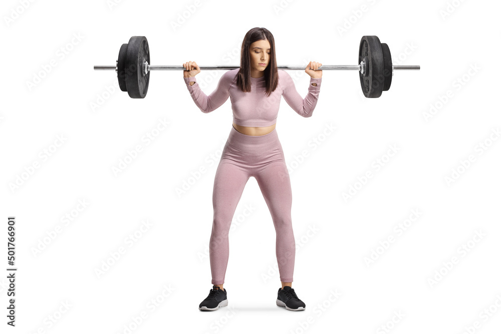Sporty female standing and lifting heavy weights Sporty female standing and lifting heavy weights