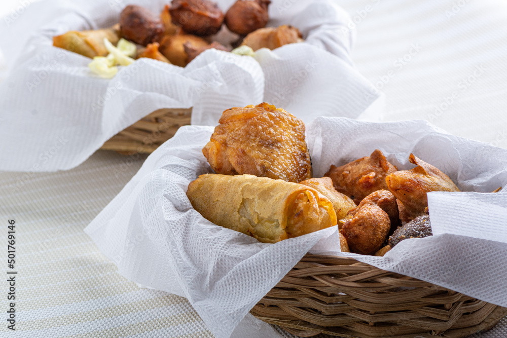 Nigerian small chops with springrolls, samosa, puffpuff in two
