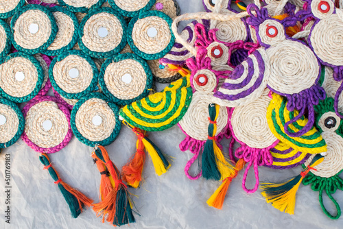 Colorful doormats and coasters made of jute , handicrafts on display during the Handicraft Fair in Kolkata , earlier Calcutta, West Bengal, India. It is the biggest handicrafts fair in Asia.