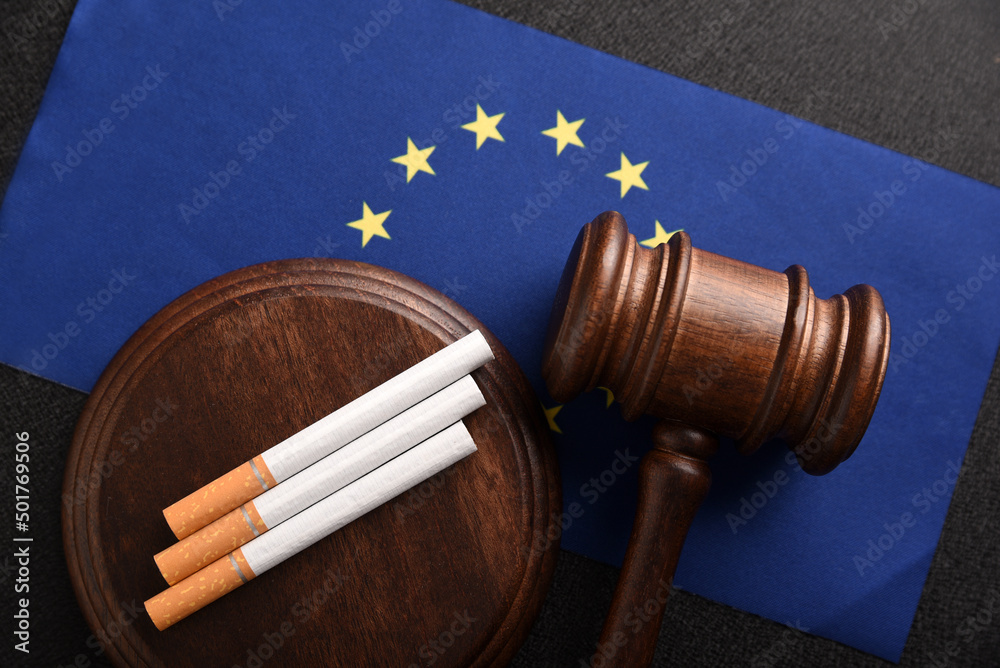 Flag of European Union, cigarettes and Judge gavel. Tobacco law. Smoking control in EU countries.