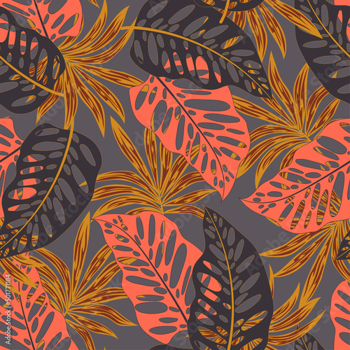 Original seamless tropical pattern with bright plants and leaves on a black background. Beautiful seamless vector floral pattern. Vector design. Jungle print. Floral background. 