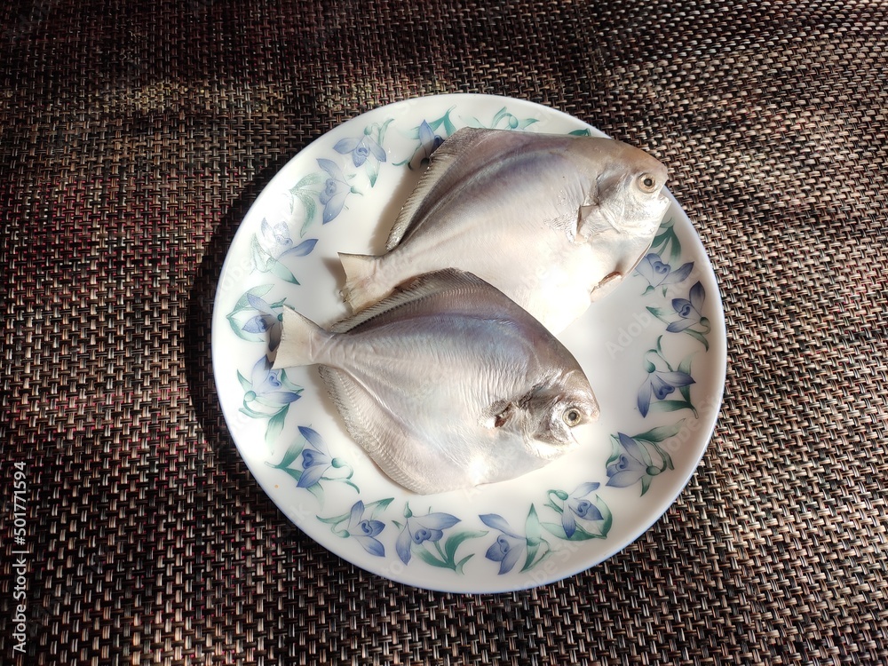 Silver pomfret or white pomfret (Pampus argenteus) is a species of