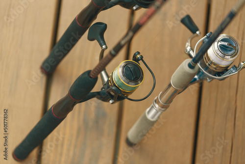 фотографія Fishing poles on cabin wood deck