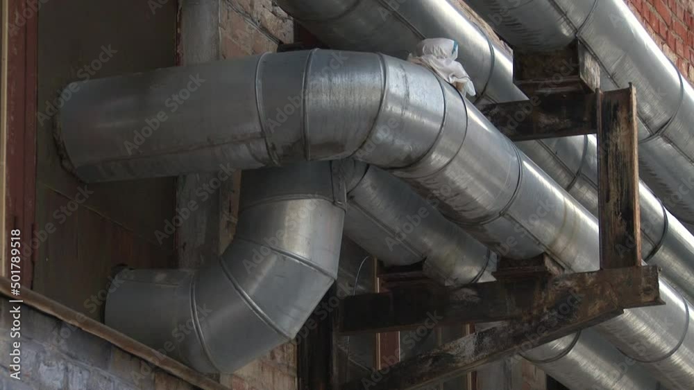 Boiler room with pipes, valves and sensors.Manometer, pipes and faucet valves of heating system in a boiler room.