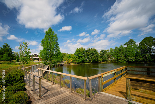 Boardwalk over lake at Reiter community park in Longwood, a suburb of Orlando in Florida