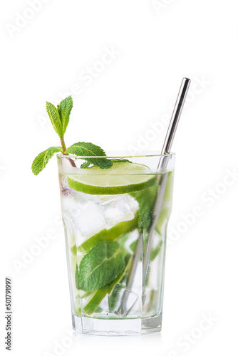 Mojito with lime and ice in a glass glass with a metal straw on a white background