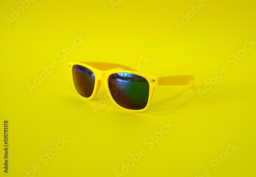 Sunglasses on a yellow background. High quality photo