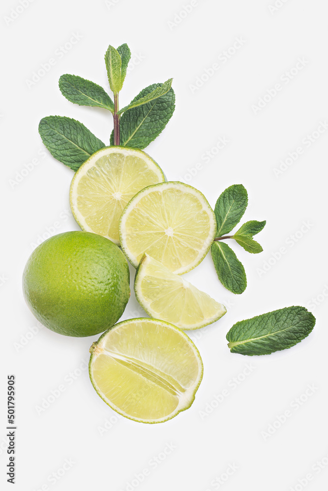 Lime slices with mint on a white isolated background