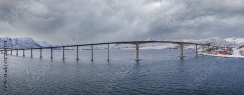 Andøy Bridge crossing the dredged Risøysundet strait between the islands of Andøya and Hinnøya, Nordland, Norway. photo
