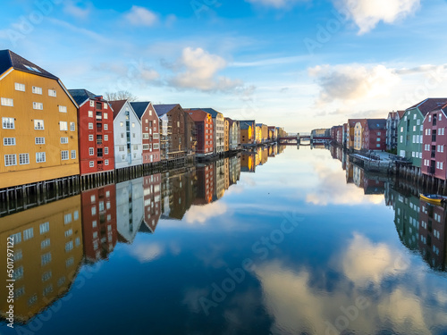 Historical wharf warehouses flanking both sides of the Nidelva river, in the Old Town of Trondheim, Trøndelag, Norway
