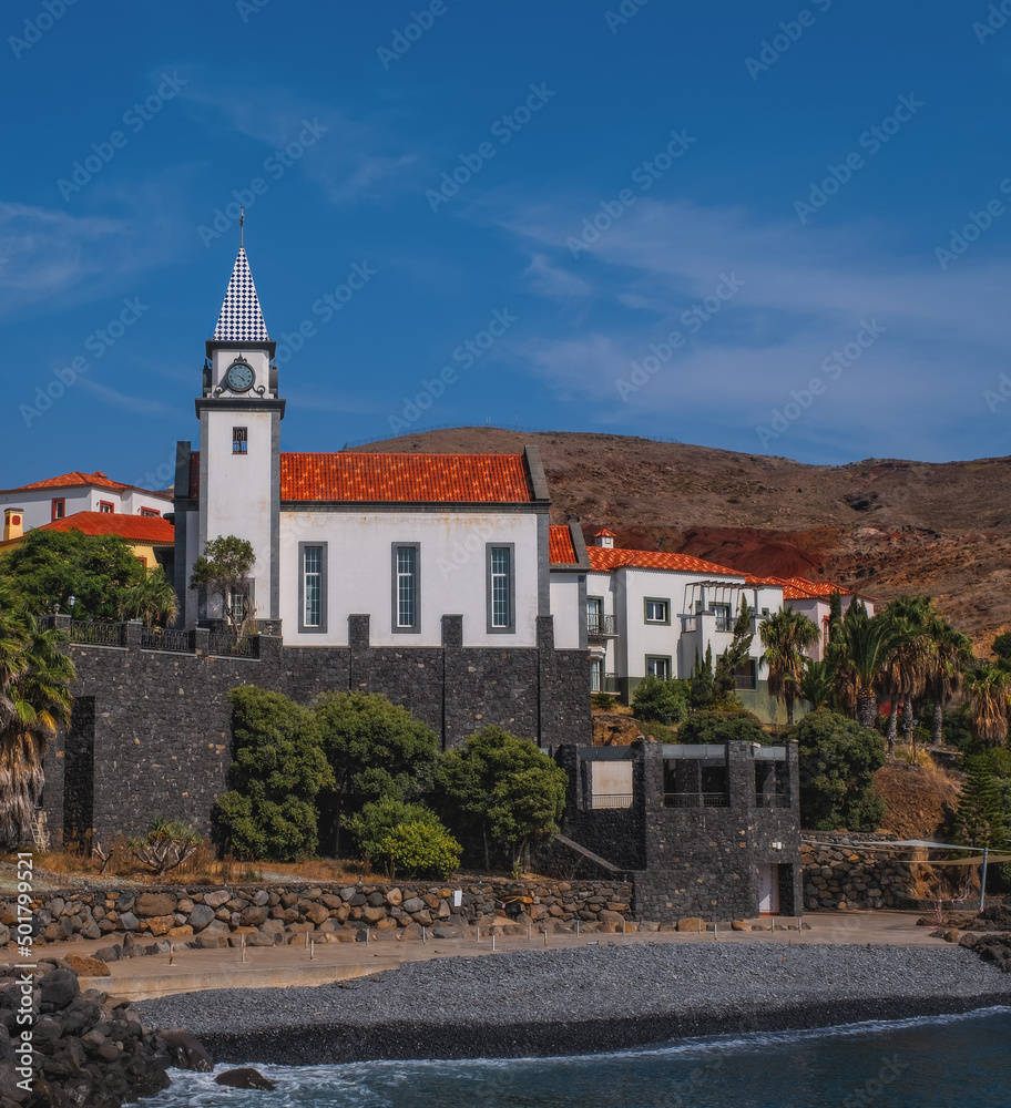 Madeira, Portugal - October 2021: Tiny resort Quinta Do Lorde on Ponta de Sao Lourenco peninsula. Gives expressions of a small cosy town with harbor for yachts, restaurants, lighthouse and church