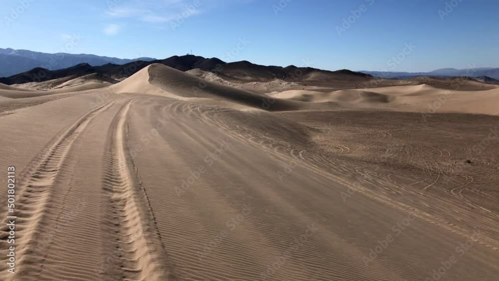 Dumont Dunes. Group of people drive on buggies at the dunes in California. High quality 4k footage Dumont Dunes. Group of people drive on buggies at the dunes in California. High quality 4k footage