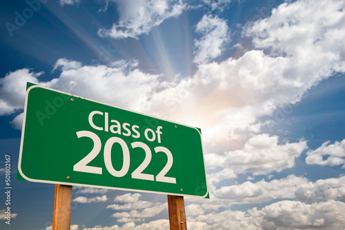 Fotografie, Obraz Class of 2022 Green Road Sign with Dramatic Clouds and Sky