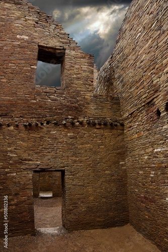Chaco Canyon ruins with dramatic stormy sky. photo