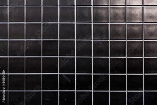 Fragment of glazed ceramic tiled wall