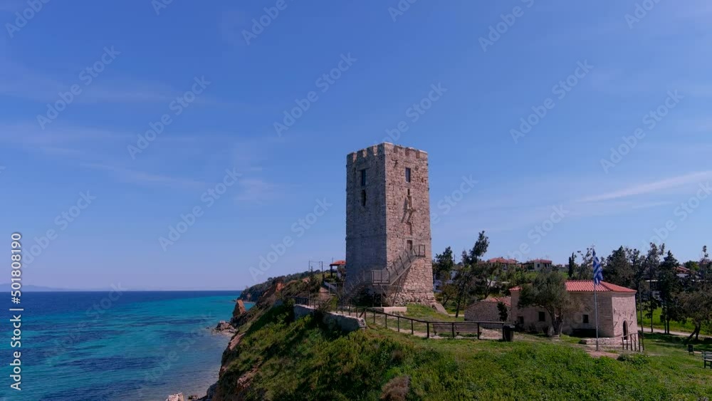 Aerial view of byzantine tower and beach of village Nea Fokea in Chalkidiki Greece Aerial view of byzantine tower and beach of village Nea Fokea in Chalkidiki Greece