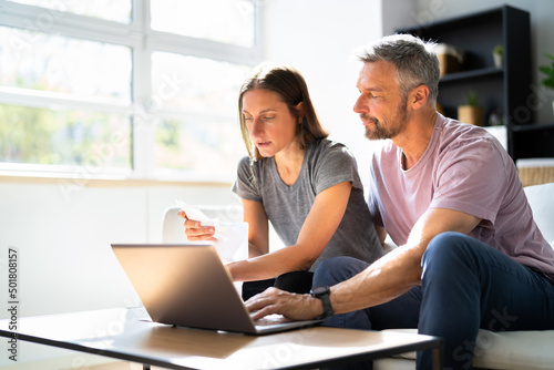 Couple Doing Taxes And Family Budget