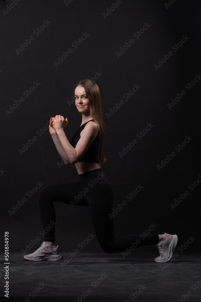 On maiden beautiful orange . A with dumbbells background black orange two gym, from shape body in fit for female care, aerobics plus. Active beginner joy, figure young overweight doing On maiden beautiful orange . A with dumbbells background black orange two gym, from shape body in fit for female care, aerobics plus. Active beginner joy, figure young overweight doing