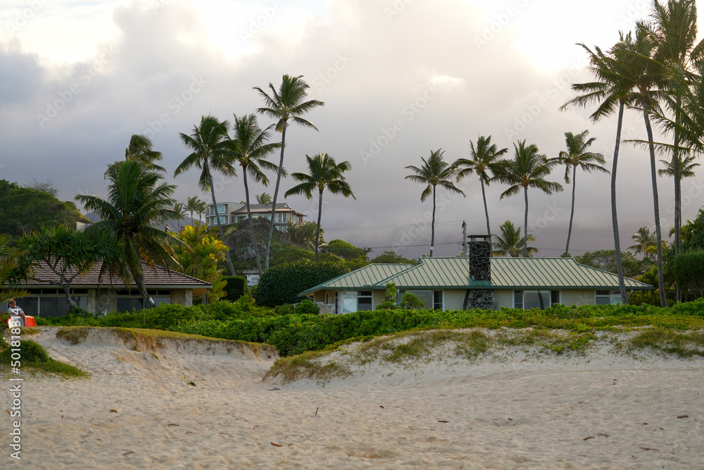 Stormy weather over an ocean front house on Lanikai Beach in Kailua, on the eastern side of Oahu in Hawaii, United States Stormy weather over an ocean front house on Lanikai Beach in Kailua, on the eastern side of Oahu in Hawaii, United States