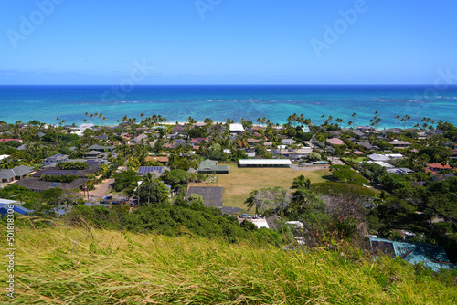 Fototapeta Naklejka Na Ścianę i Meble -  Ocean front neighborhood of Lanikai Beach in Kailua, as seen from the Lanikai Pillbox hike, on the eastern side of Oahu in Hawaii, United States