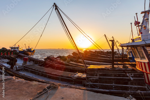 Wooden fishing boats on the coast in the evening