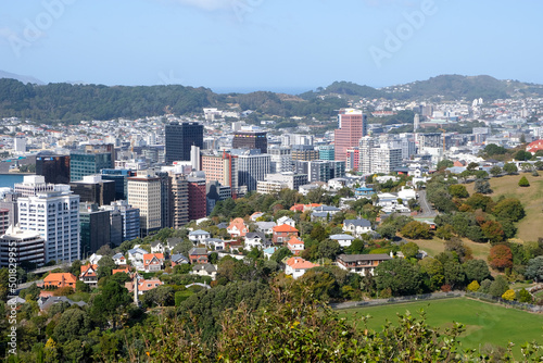 A expansive view of capital city Wellington, residential houses, skyscraper tower blocks and hills in Wellington, New Zealand, Aotearoa
