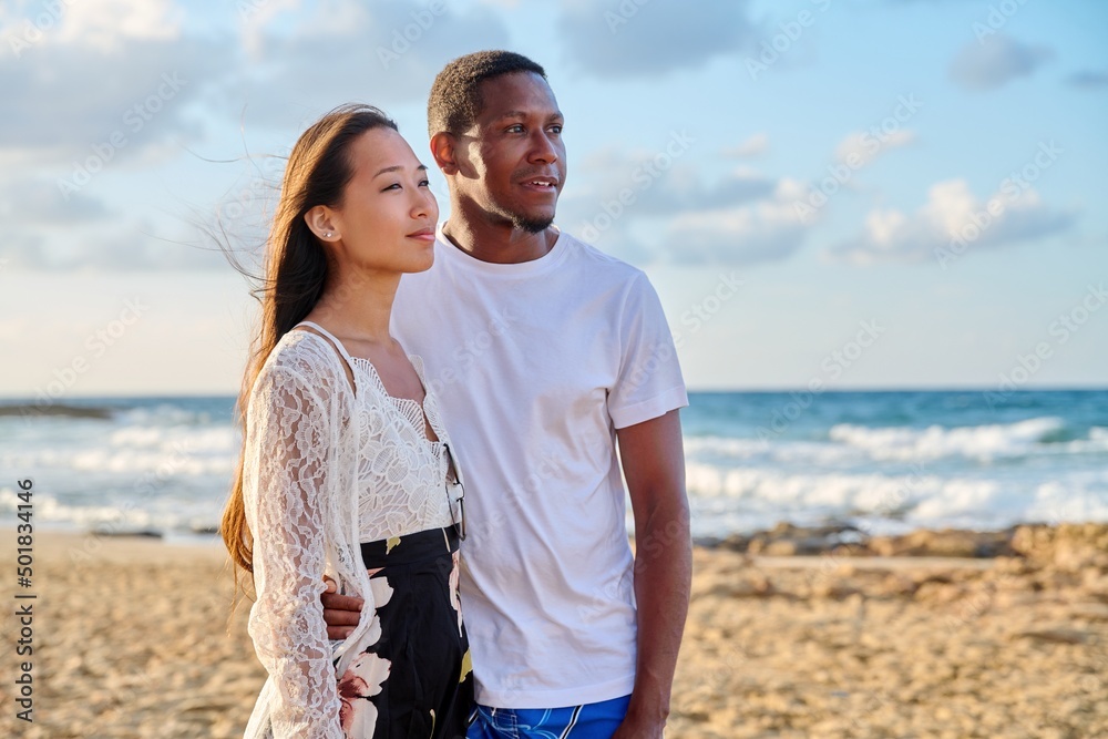 Young couple in love on the beach together. Young couple in love on the beach together.