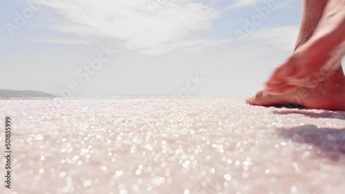 Static close up view female walk barefoot on salt lake relaxation . Healthy natural salt benefits concept