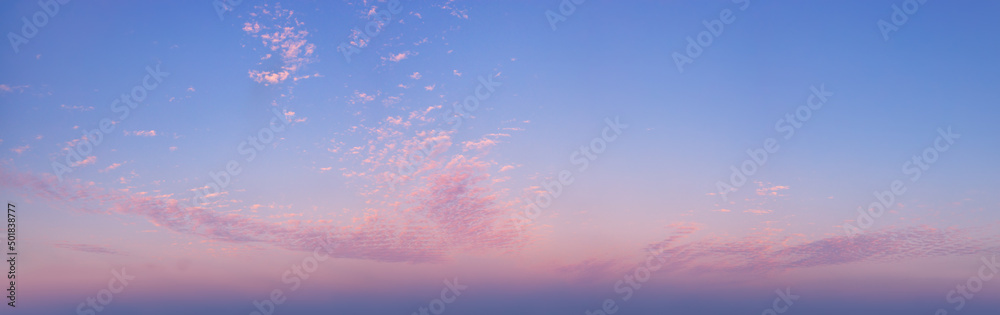 Fototapeta premium panorama photo of picturesque sky with spindrift clouds on sunrise