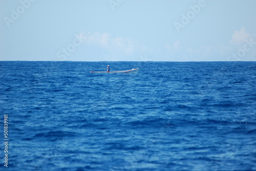 fisherman boat in the blue sea off the coast of mauritius © Mikhail
