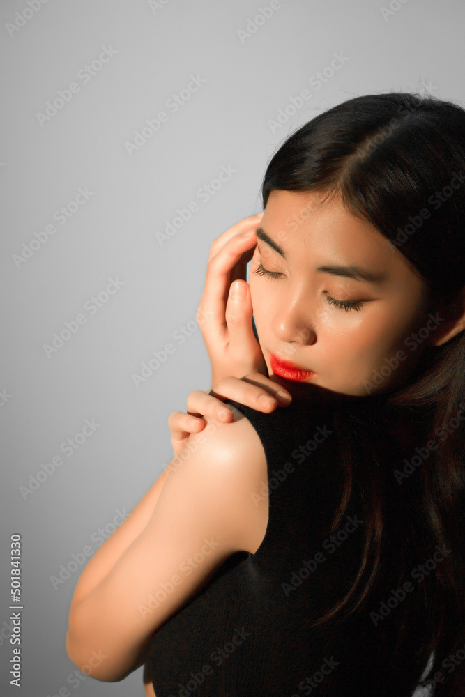 Fashion and beauty concept, Fashion woman use hands to make posing on gray background Fashion and beauty concept, Fashion woman use hands to make posing on gray background