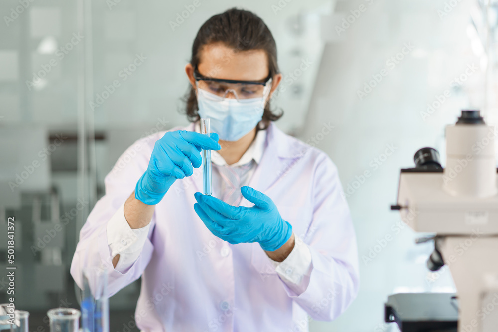 Laboratory research concept, Scientist analyzing sample in test tube to developing drug and vaccine Laboratory research concept, Scientist analyzing sample in test tube to developing drug and vaccine