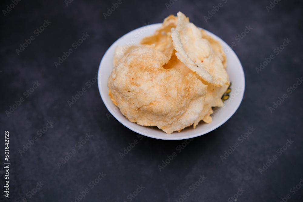 Melinjo crackers are one of the typical crackers from Indonesia made from melinjo seeds Melinjo crackers are one of the typical crackers from Indonesia made from melinjo seeds