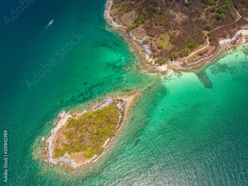 Aerial view of beautiful landscape cliff island beach with green mountain view at Koh Si Chang island Chon Buri Province, Thailand.