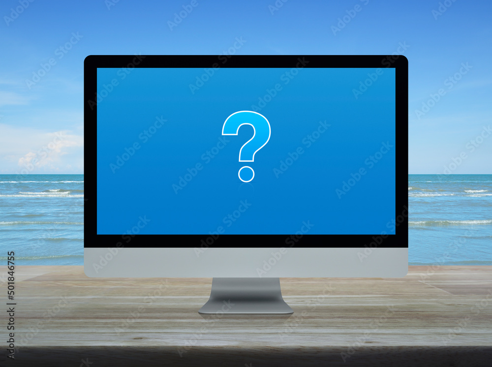 Question mark sign icon on modern laptop computer screen on wooden table over tropical sea and blue sky with white clouds, Business customer service and support online concept