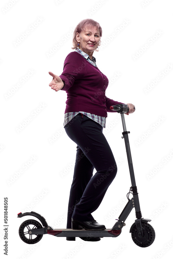 friendly elderly woman on an electric scooter. isolated on a white friendly elderly woman on an electric scooter. isolated on a white