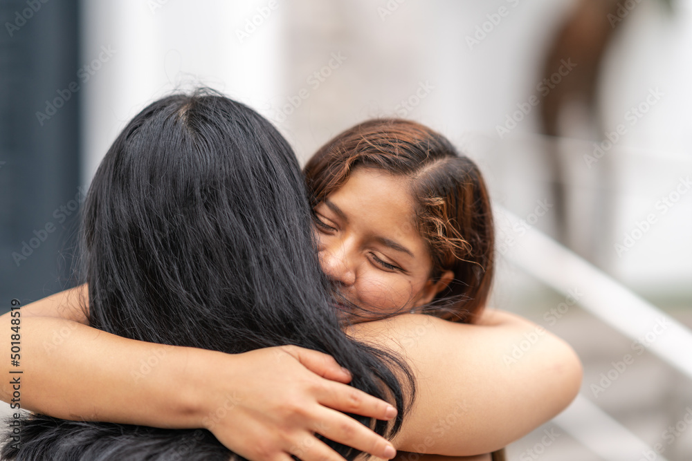 Affectionate embrace between friends in the street, with eyes closed. Affectionate embrace between friends in the street, with eyes closed.