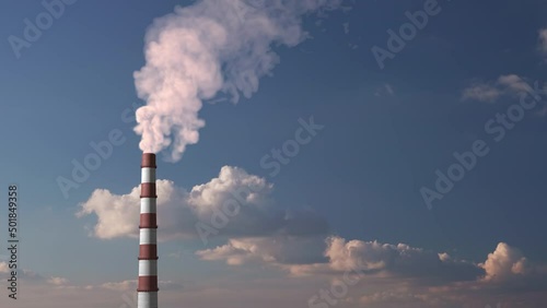 
A huge pipe smokes and pollutes the atmosphere.