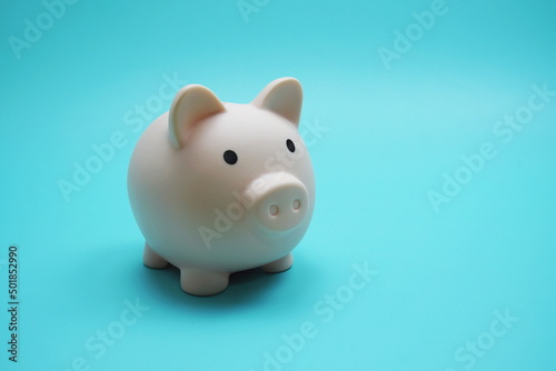 Piggy Bank Saving finance concept on blue background © may1985