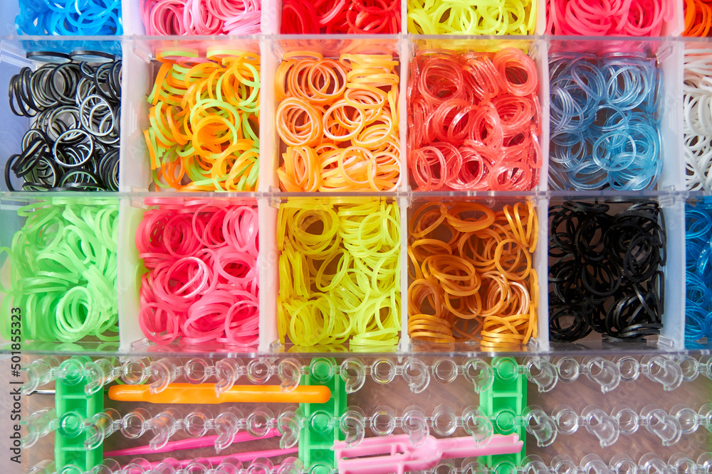 A set of colorful rubber bands and loom knit for knitting wristbands. A set of colorful rubber bands and loom knit for knitting wristbands.