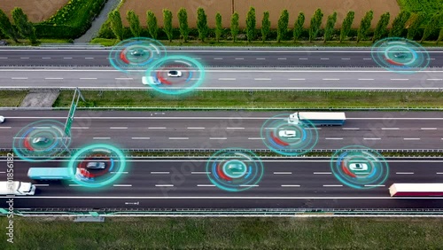 Aerial view of Self Driving Autonomous Cars with HUD-Elements on Highway. Futuristic Intelligent Traffic Detection System. Concept of Smart Transportation.